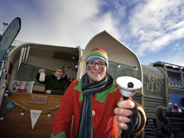 Joe McCarthy and James Gallagher ring the bell at their gin stall.