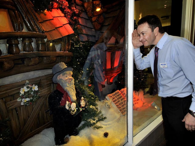 A staff member peers in on the display in 2013.