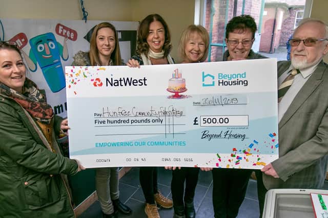Beyond Housing Community Connectors Helen Swinger and Laura Young present a cheque for 500 to Heather Nicholson, Annette Taylor, Karen Hollinghurst and Hunmanby Parish Council Chairman Harvey Stockdale.