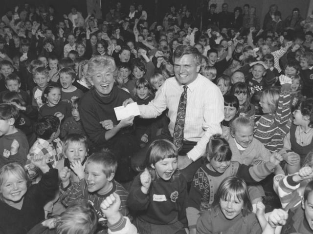 Overdale School presented the Children in Need charity with a cheque for 100 which the school raised back in November 1995. BBC representative Faye Yeomans is pictured receiveing the cheque from Overdale's headteacher, surrounded by pupils.