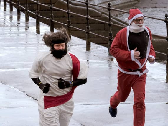 Two runners brave the elements. Picture by Richard Ponter