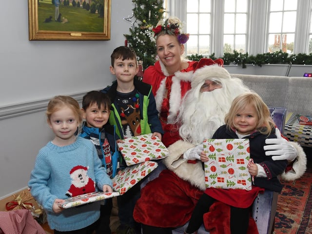Children have a story time with Santa.