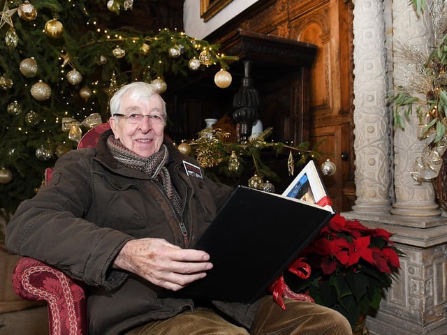 Taking in the hall's decorations... Godfrey Cutts.