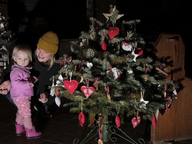 Evelyn with mum Sarah Caines enjoys the trees..