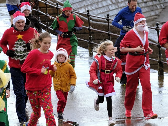 Little ones run alongside the grown ups.