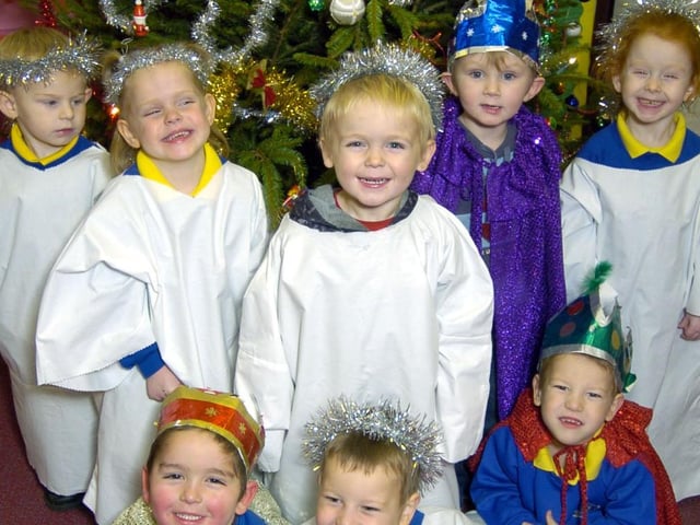 Nativity kids under the Christmas tree.
