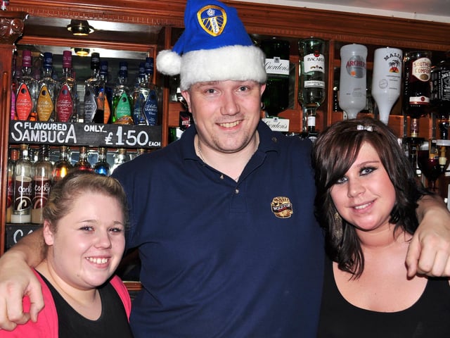 Laura, Dan and Kayleigh serve the drinks in Scholars.