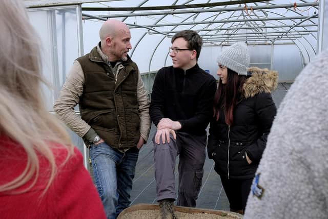 Eskdale Inn Director Marcus Boxshall -Smith, chats to volunteers Anabel and Alasdair about the project - Pic: Richard Ponter