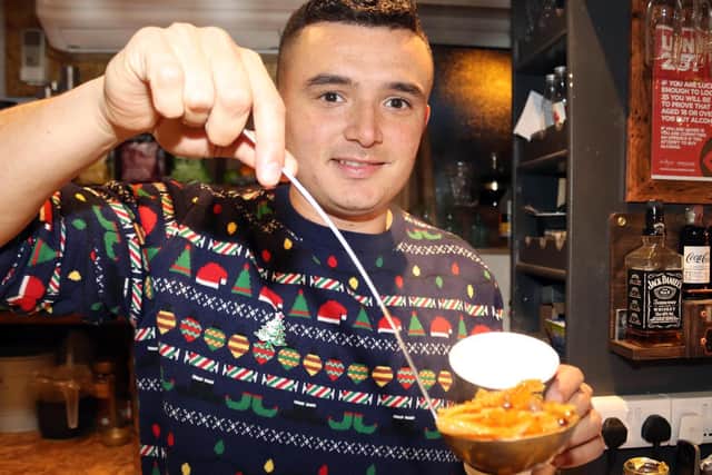 Hideout Manager Jordan Padgham serves up the homemade soup.