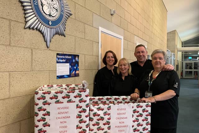 Deployment Manager Lynn Broadbent and colleagues from the forces Force Control Room with some of their donations.