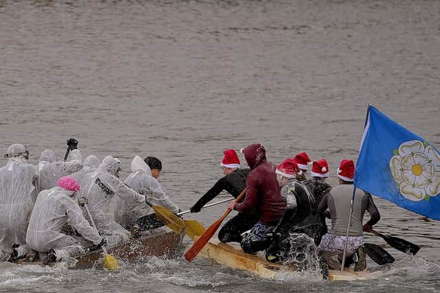 Two teams battle it out in the raft race. Picture by Richard Ponter.