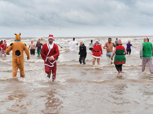 Many people braved the waters in fancy dress.