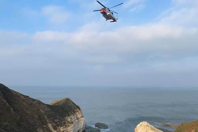 The helicopter rescuing the injured person. Picture from Bridlington Coastguard