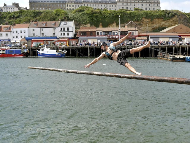 Failing the greasy pole challenge at Whitby Regatta. Photo: Richard Ponter