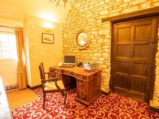 A large room with a rear aspect window, a perfect quiet work space.