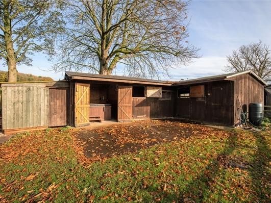 A separate stable block is part of the grounds.