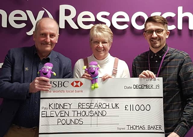 Chris and June Chapman are pictured handing over the cheque to Richard Phillips of Kidney Research UK