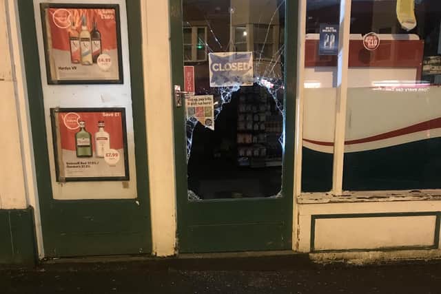 The smashed glass door.