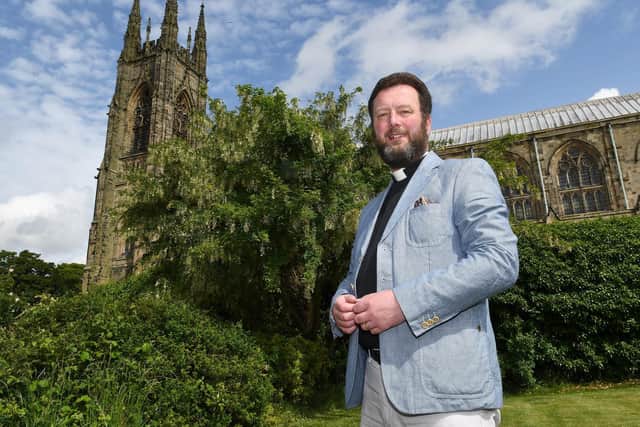 The Rev Matthew Pollard, pictured outside Priory Church in 2018