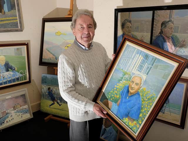 Alan Stuttle with some of his work.