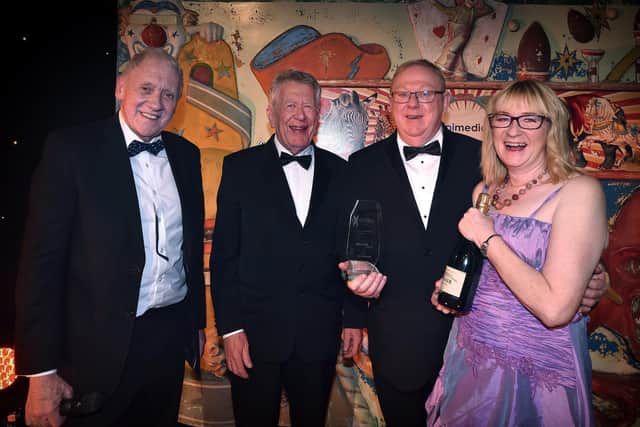 Roots of Yggdrasil receice their Excellence in Business award in November, from compere Harry Gration, left, and category sponsor Andrew Boyes, second left.