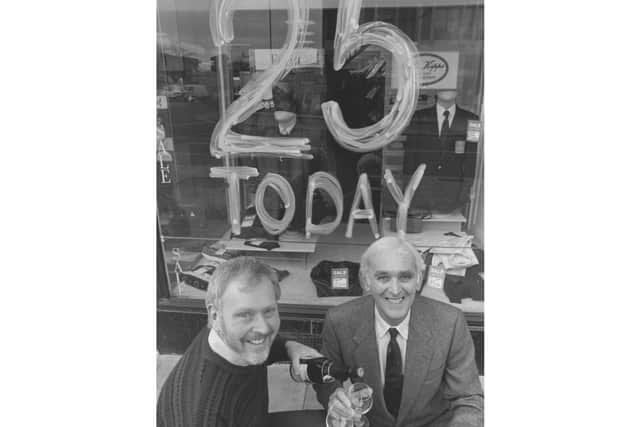 Gordon and Anthony outside the shop celebrating their 25th anniversary. Picture: JPI Media