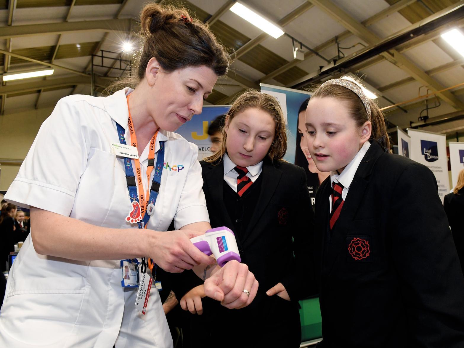Podiatrist Jenny Laney with Georgina Fowler,11, and Courtney Middleton, 11.