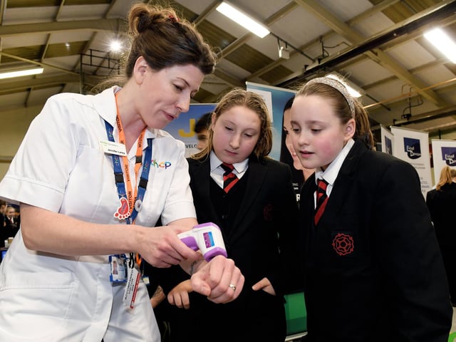 Podiatrist Jenny Laney with Georgina Fowler,11, and Courtney Middleton, 11.