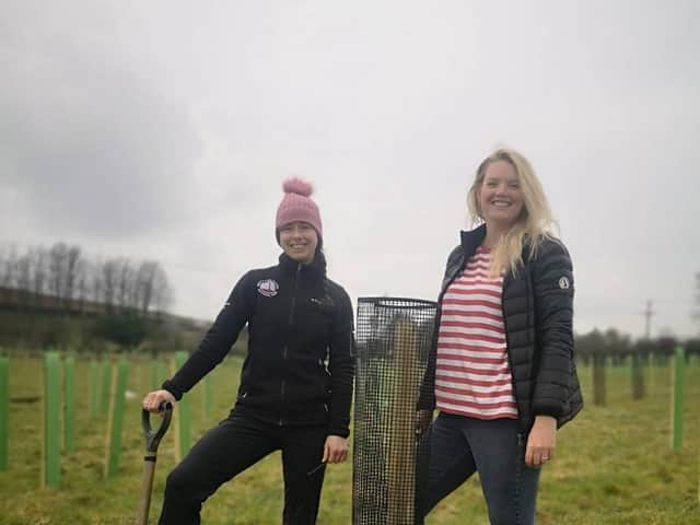 Emily Watson and Laura Barr from the North York Moors National Park Authority, supporting a landowner to plant new trees.