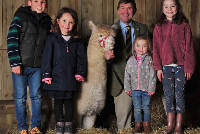 L to R Luca Francisco aged 8, Bella Francisco aged 5 with Marshmallow the Alpaca, Show Director Charles Mills, Sophie Prentice aged 3 and Beth Prentice aged 10.