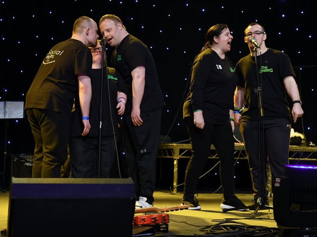 Singers enjoying themselves on stage.