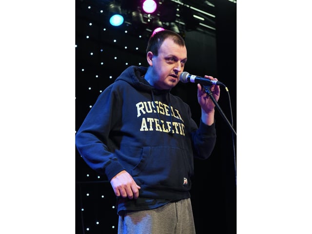 A singer takes their turn on stage.