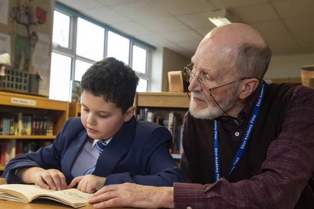 Phil Harrison reading with a pupil at the Ebor Academy