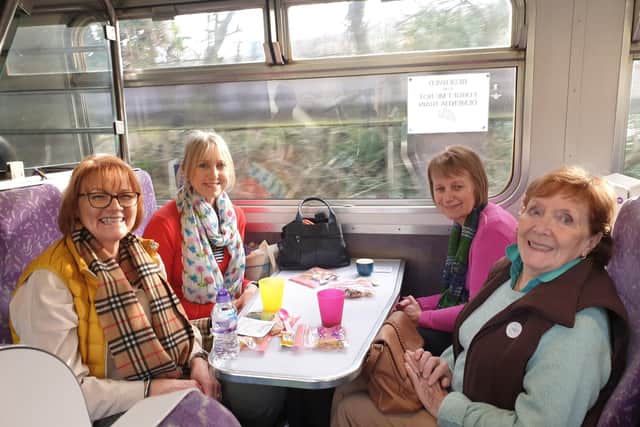Zoe & Marianne, side by side volunteers from Autistic Society travelling with Helen & Dot