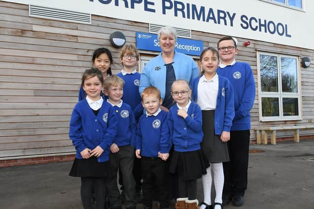 Kath Carlisle outside Hilderthorpe Primary School with some of her pupils. Picture: JPI Media/ Paul Atkinson