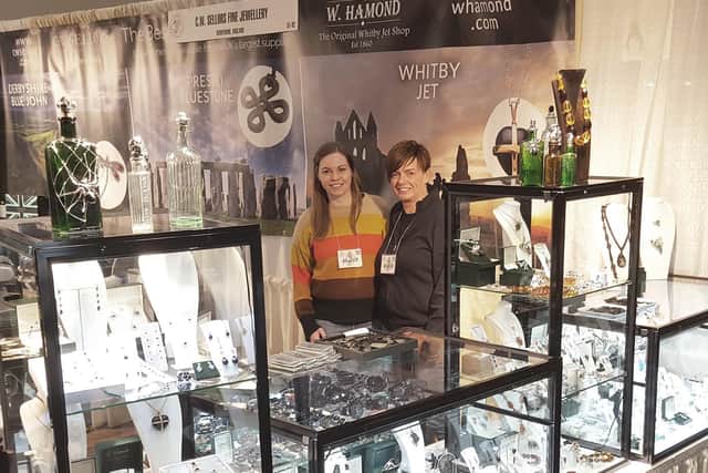 Rebecca Tucker and Sally Robinson from W Hamond showcasing Whitby Jet in Tucson, Arizona