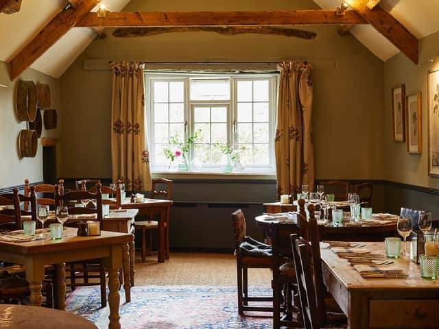The cosy dining room of the Kingham Plough