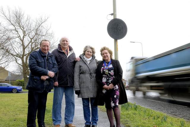 Cllr David Raine, Cllr WH Smith, Vanessa Milner and Cllr Lynda Wallis by the sign on the B1261 near Crossgates.