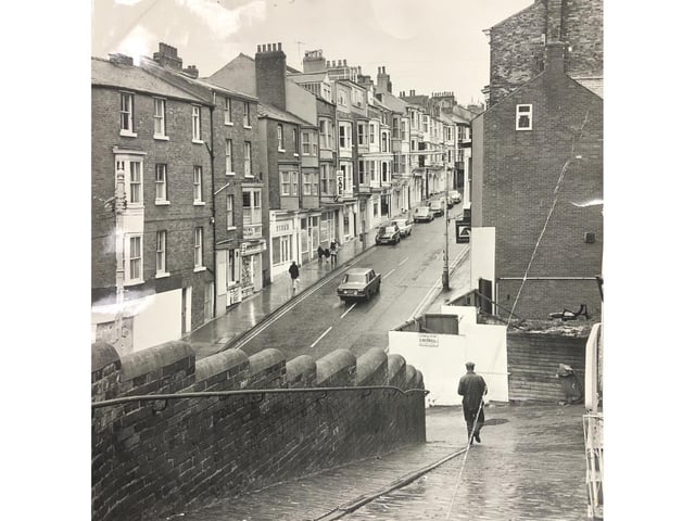 A man walks down West Sandgate towards the bottom of Eastborough. The shop on the corner has not yet become The Joke Shop - do you know which year or decade this was?