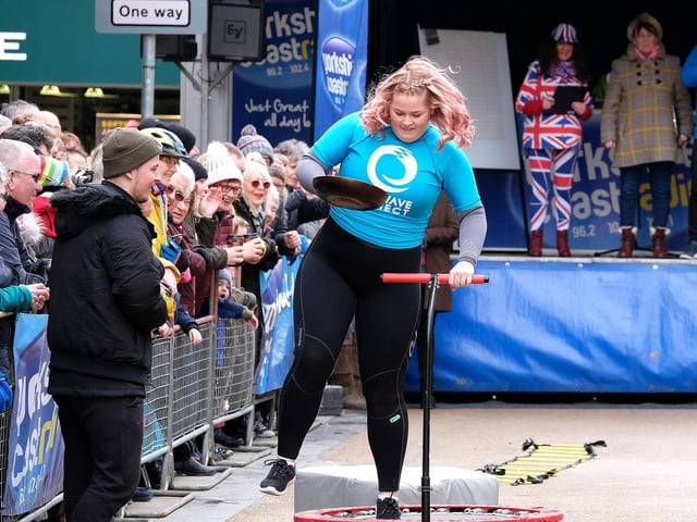 Taking on the obstacles while the judges look on.