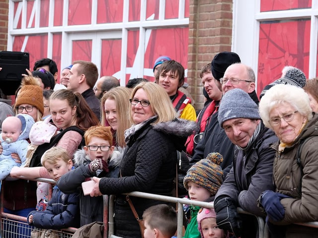 The crowds being entertained by the race.