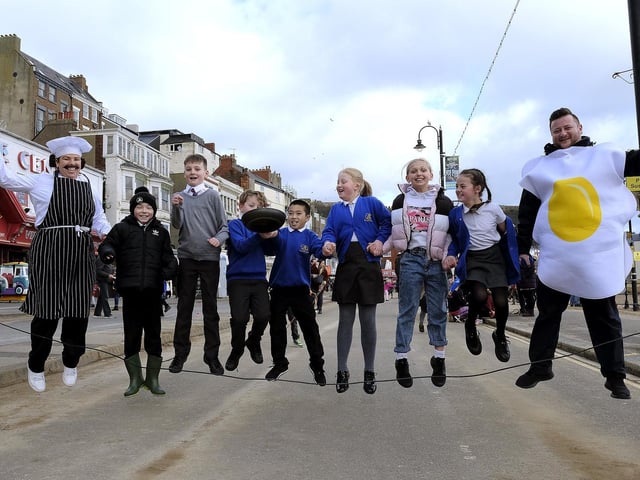 Gladstone Road teacher Miss Mountford, left and headteacher Mr Johnson, right take part with some of their students.