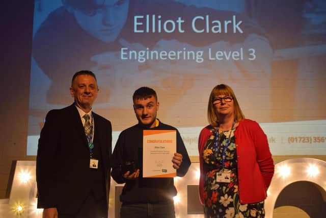 Elliot Clark is presented with the YES Apprentice of the Year 2020 Award by Alan Hadfield, Head of Apprenticeships, and Ann Hardy, Principal of Scarborough TEC.
