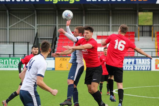Rovers' goalscorer Sam Pickard beats Jamie Patterson to a header
PHOTOS BY ALEC COULSON