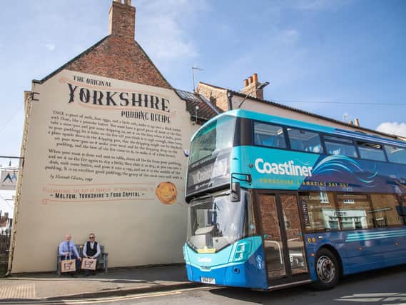 Coastliner General Manager Ben Mansfield (left) and Mark Brayshaw, Head of Visit Malton, celebrate the new partnership between the bus operator and the organisation behind Maltons success as Yorkshires Food Capital.