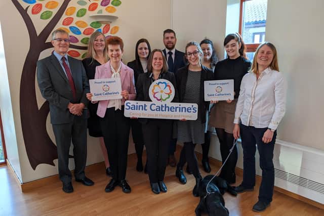 Left to right, back row, Paul Midgley, Beverley Simpson, Emma Silkstone, Paul Richardson, Alison Jeffels. Front row, Catherine McNeill, Tracy Murray, Jessica Walker, Beth Foster, Fiona Mullane with Bramble the dog.