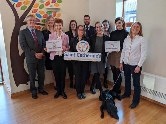 Left to right, back row, Paul Midgley, Beverley Simpson, Emma Silkstone, Paul Richardson, Alison Jeffels. Front row, Catherine McNeill, Tracy Murray, Jessica Walker, Beth Foster, Fiona Mullane with Bramble the dog.