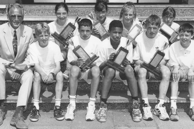 Graham School head teacher Milton Bowers, left, is pictured with school's sports day winners in June 1996. Back, J Black, J Pettitt, A Prince, S Webb; front, C Hill, A Connell, JJ Wilkinson, D O'Neill, C Dove.