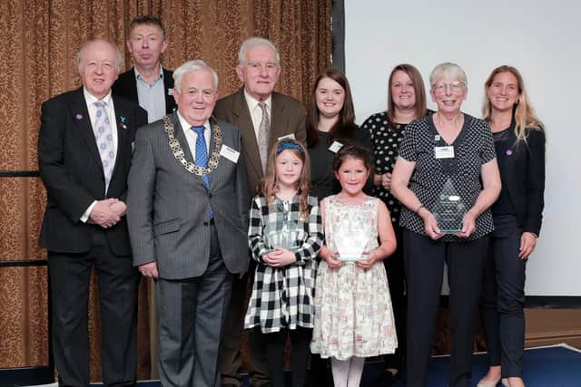County Council leader Cllr Carl Les (far left) and chairman Cllr Jim Clark (third left) with Community Award winners 2019