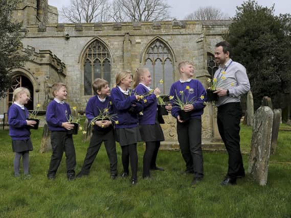 Headteacher Olly Cooper and pupils from Brompton and Sawdon County Primary School